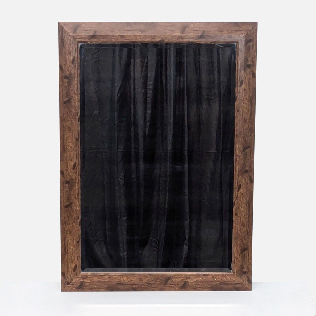 a large, black and white mirror with a black curtain.