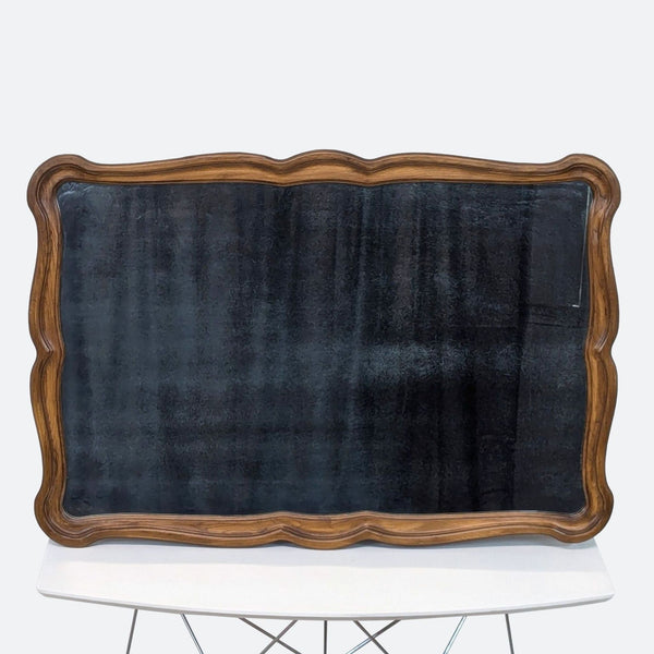 a blackboard with a wooden frame and a wooden frame.