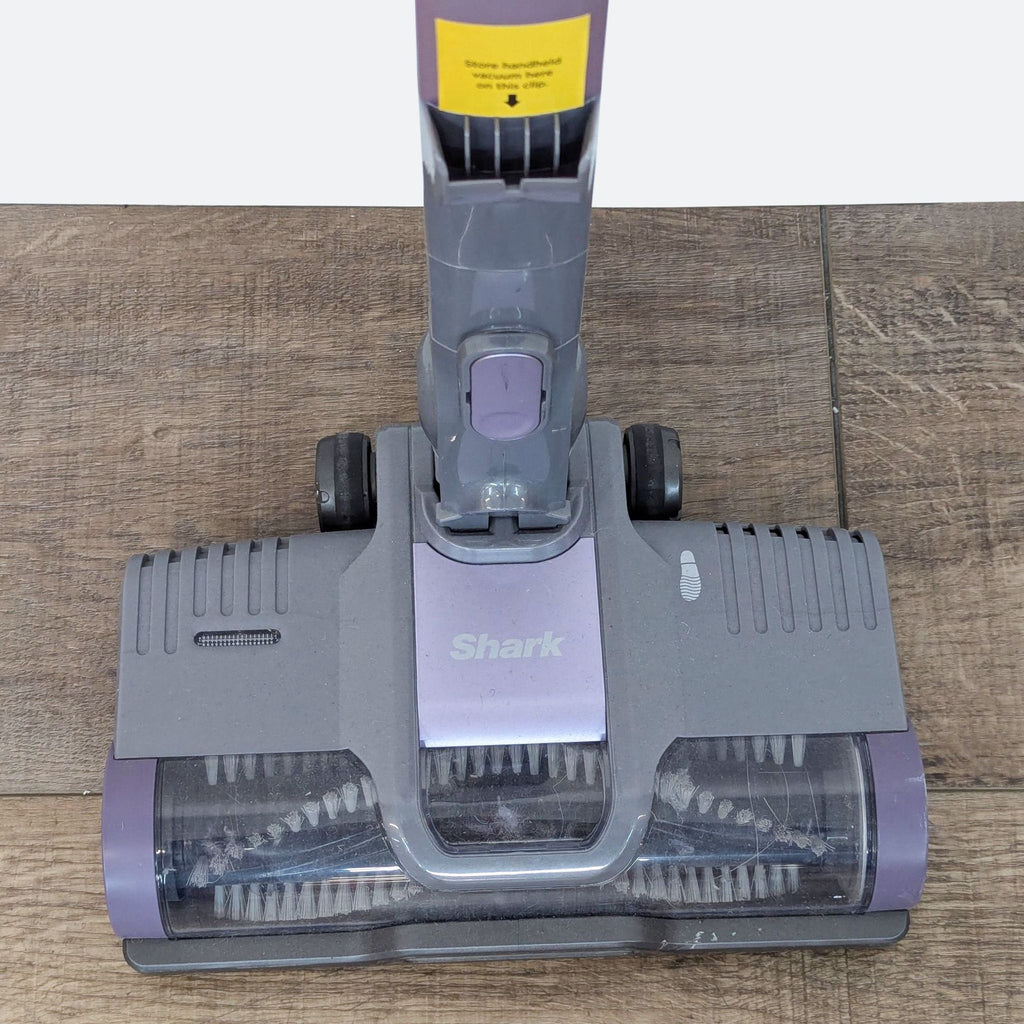 a close up of a vacuum cleaner on a wooden floor.