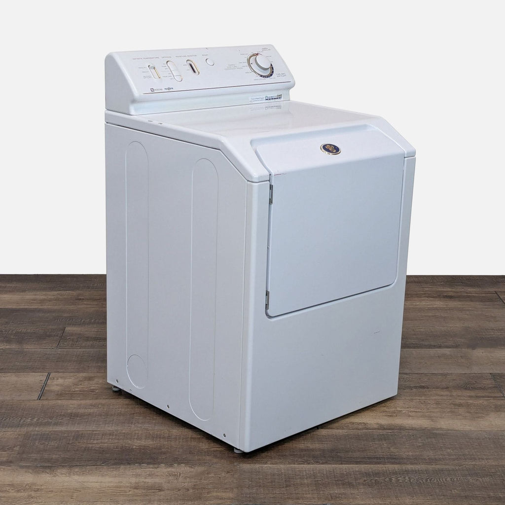 a white washer and dryer on a wooden floor.