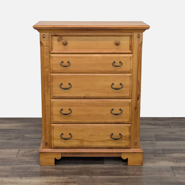 a tall chest of drawers with a wooden top.