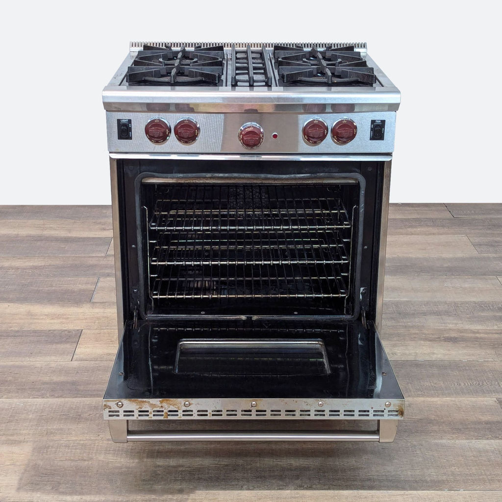 a stainless steel double oven with four burners.