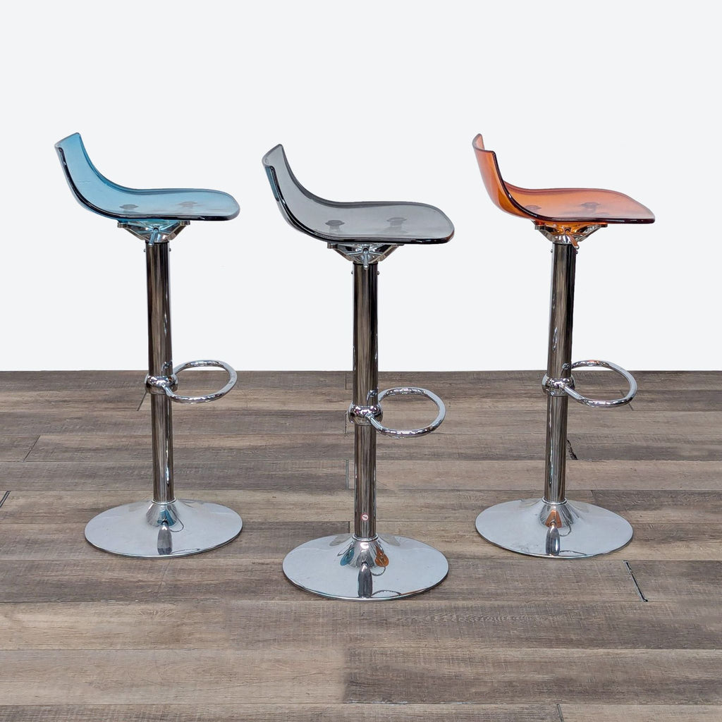 set of three chrome and leather bar stools with a chrome frame and chrome legs