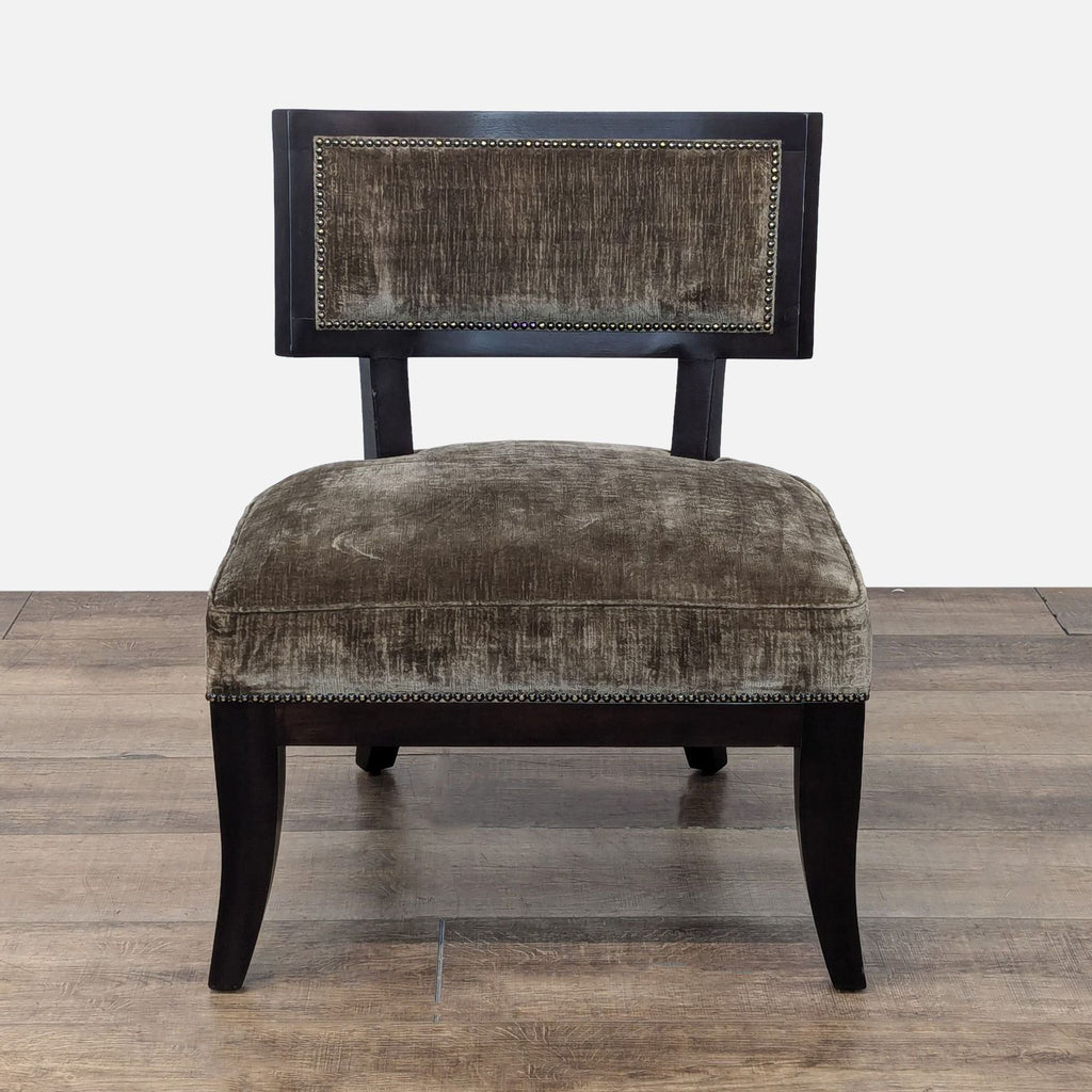 a pair of black velvet upholstered chairs