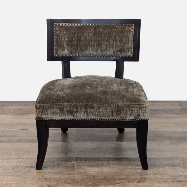 a pair of black velvet upholstered chairs