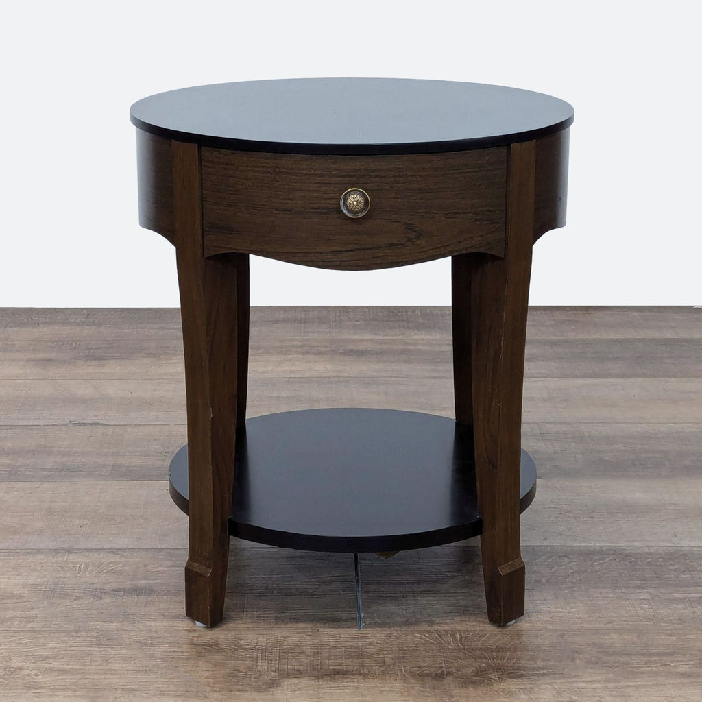 the round side table is made from solid wood with a dark wood finish.