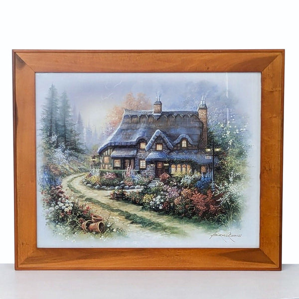 framed oil painting of a cottage in the woods