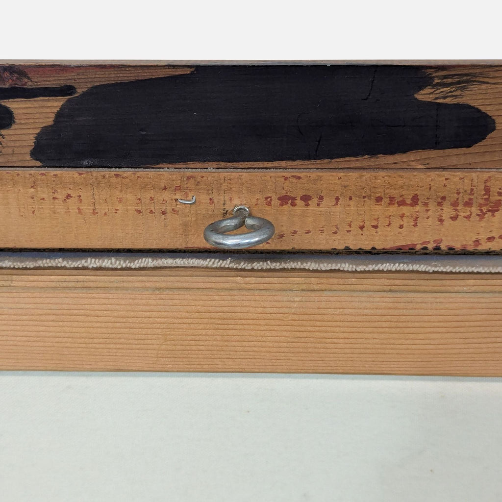 a wood box with a metal handle.