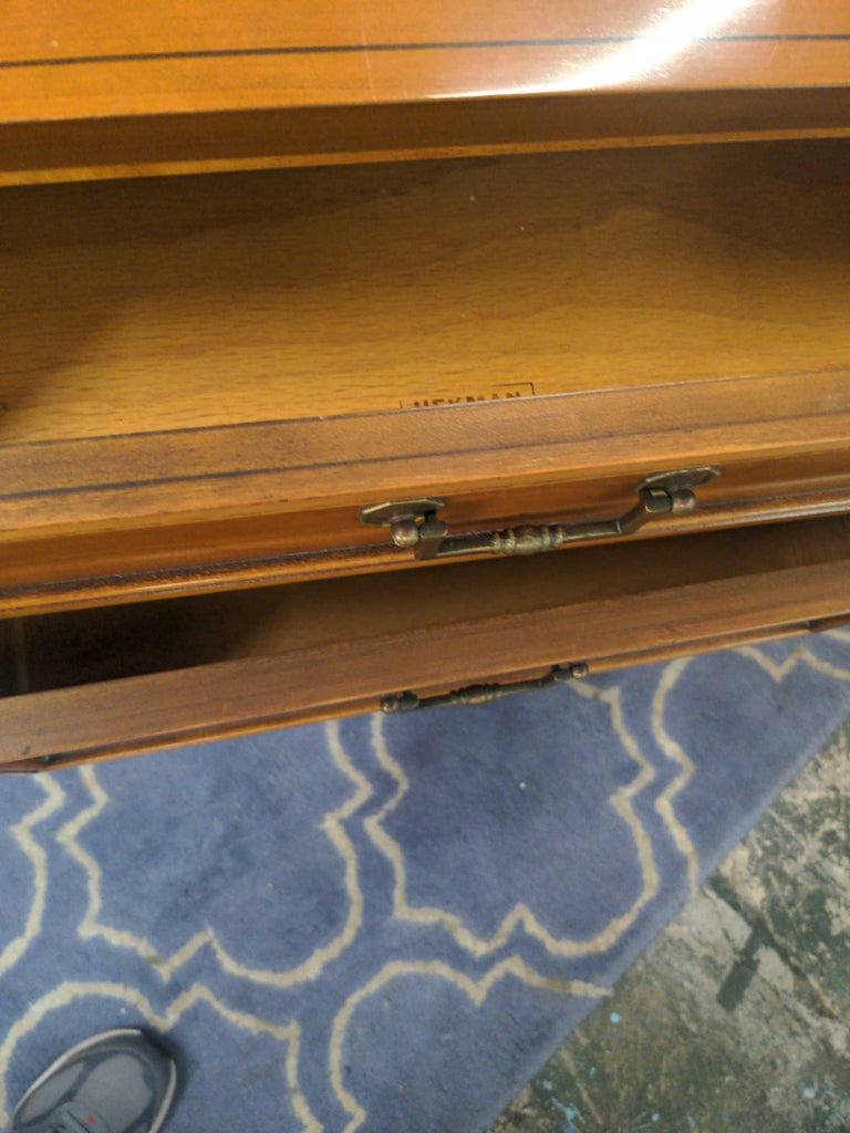 a vintage desk with a drawer open
