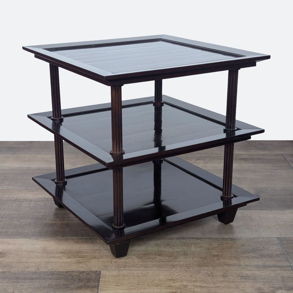 a set of three tiered black and brown wood side tables.