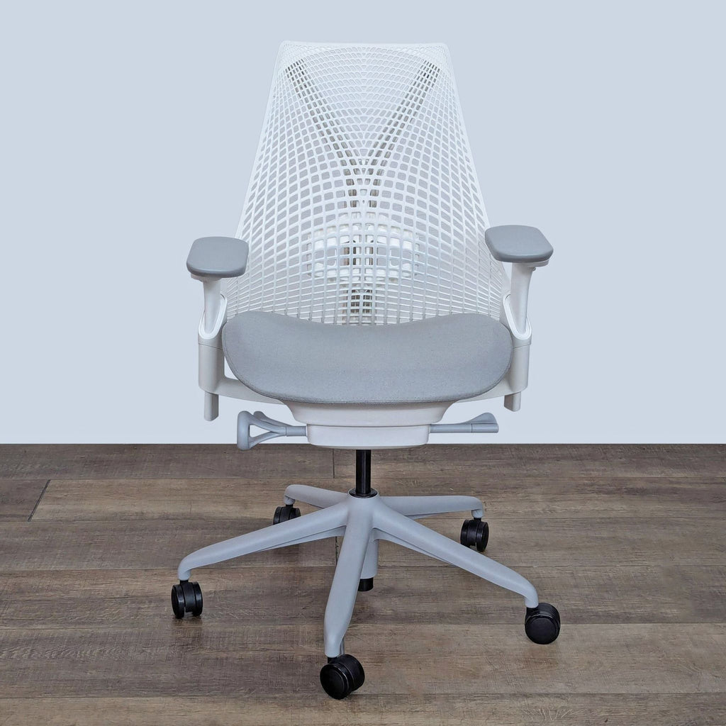 the chair is a white mesh chair with a black seat and legs.