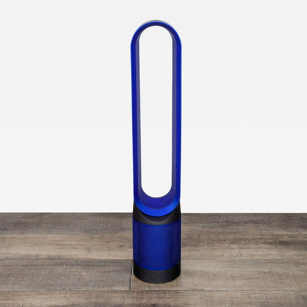 a blue and white vase sitting on a wooden table 