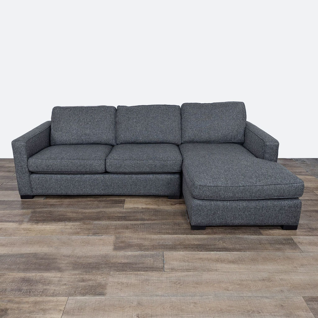 sofa is a modern sofa that is made of soft grey fabric. the sofa is made of a