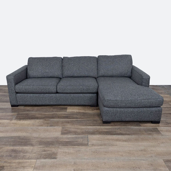 Modern gray sectional with chaise, black wood feet, brand Reperch.