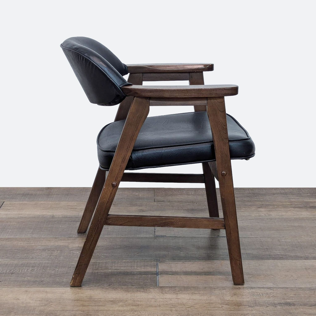 a chair with a wooden seat on top of it 