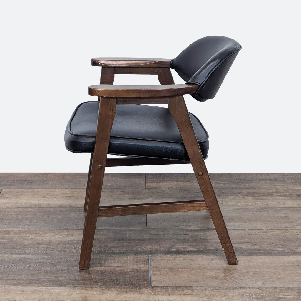 a chair with a wooden seat on top of it 