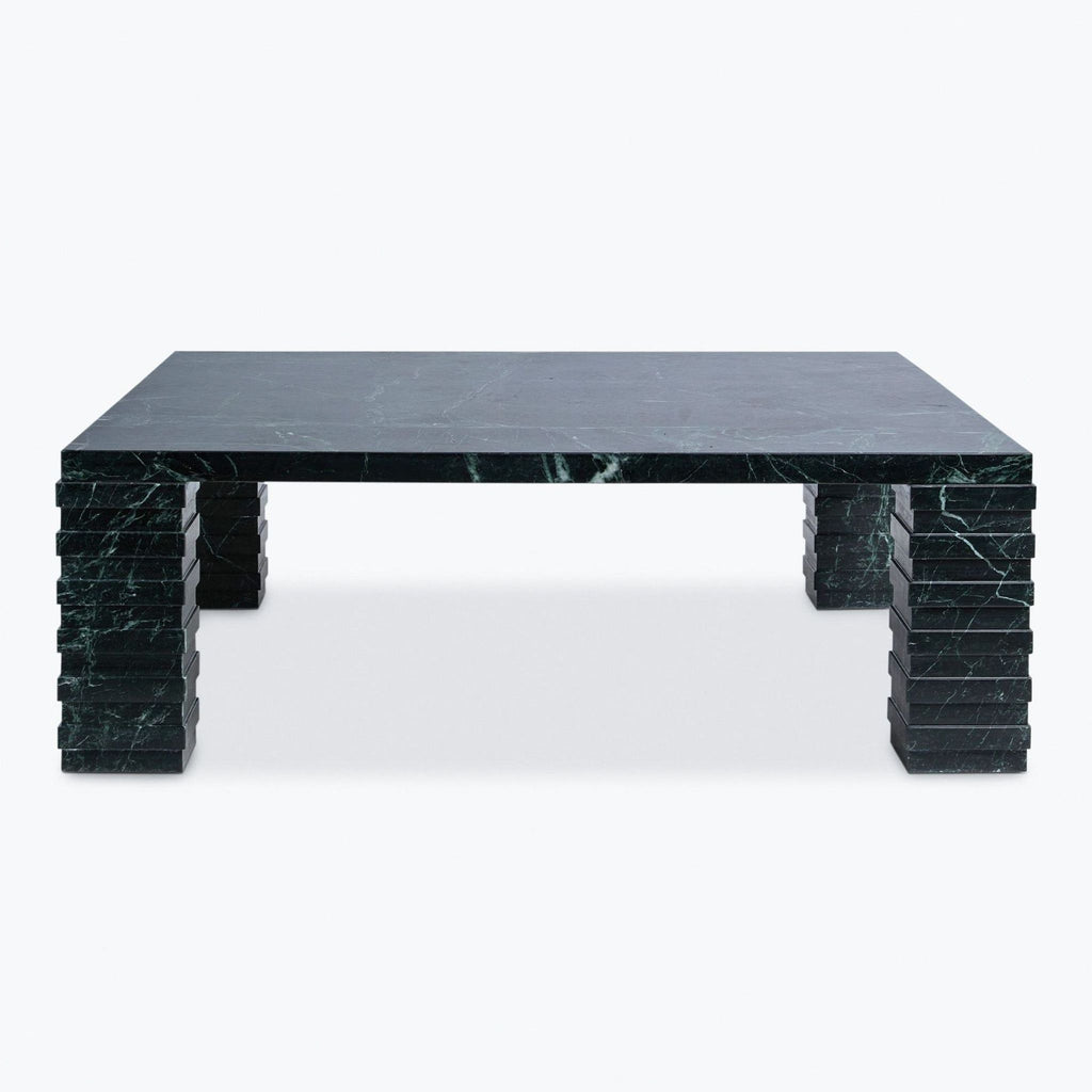 a coffee table with a black marble top.