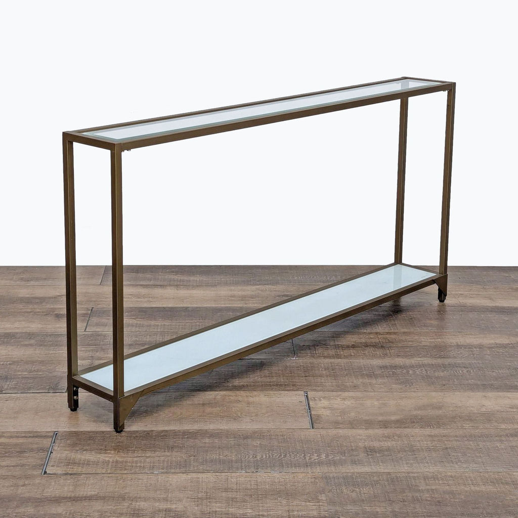 a large image of a large brass and glass shelf.