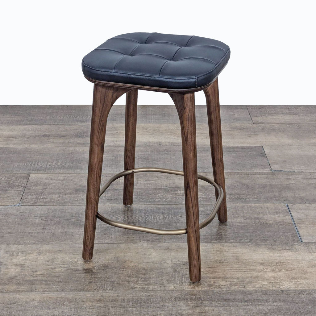 a wooden chair sitting on top of a wooden floor 