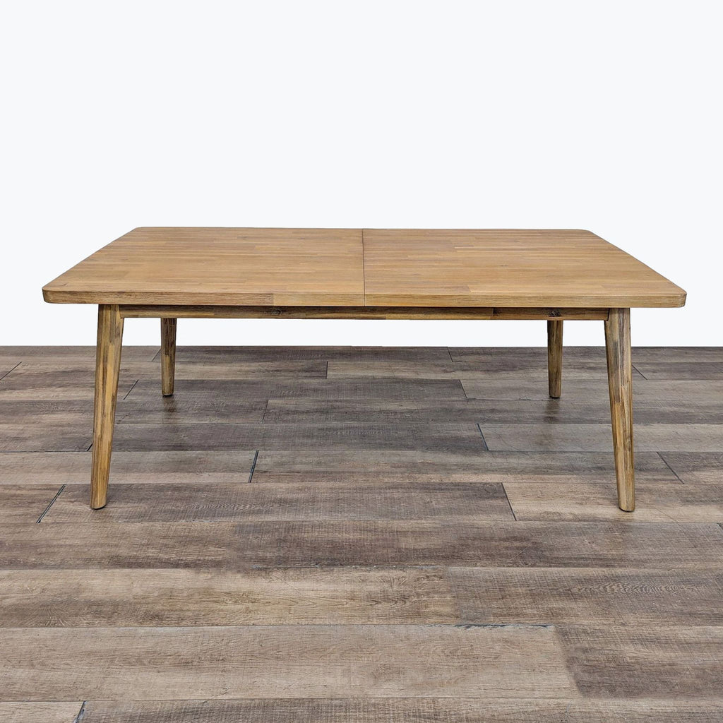 a coffee table with a teak top and a wooden frame.