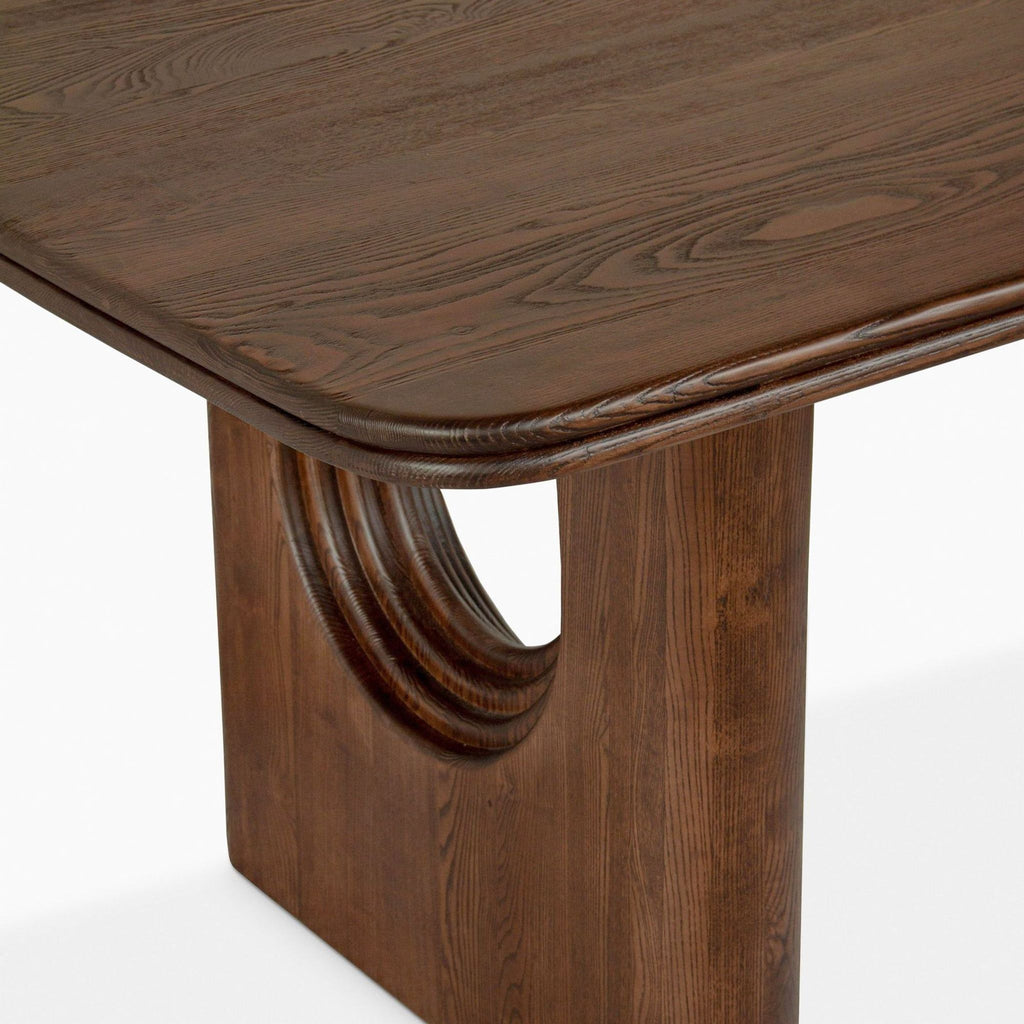 a close up of a table with a curved top.