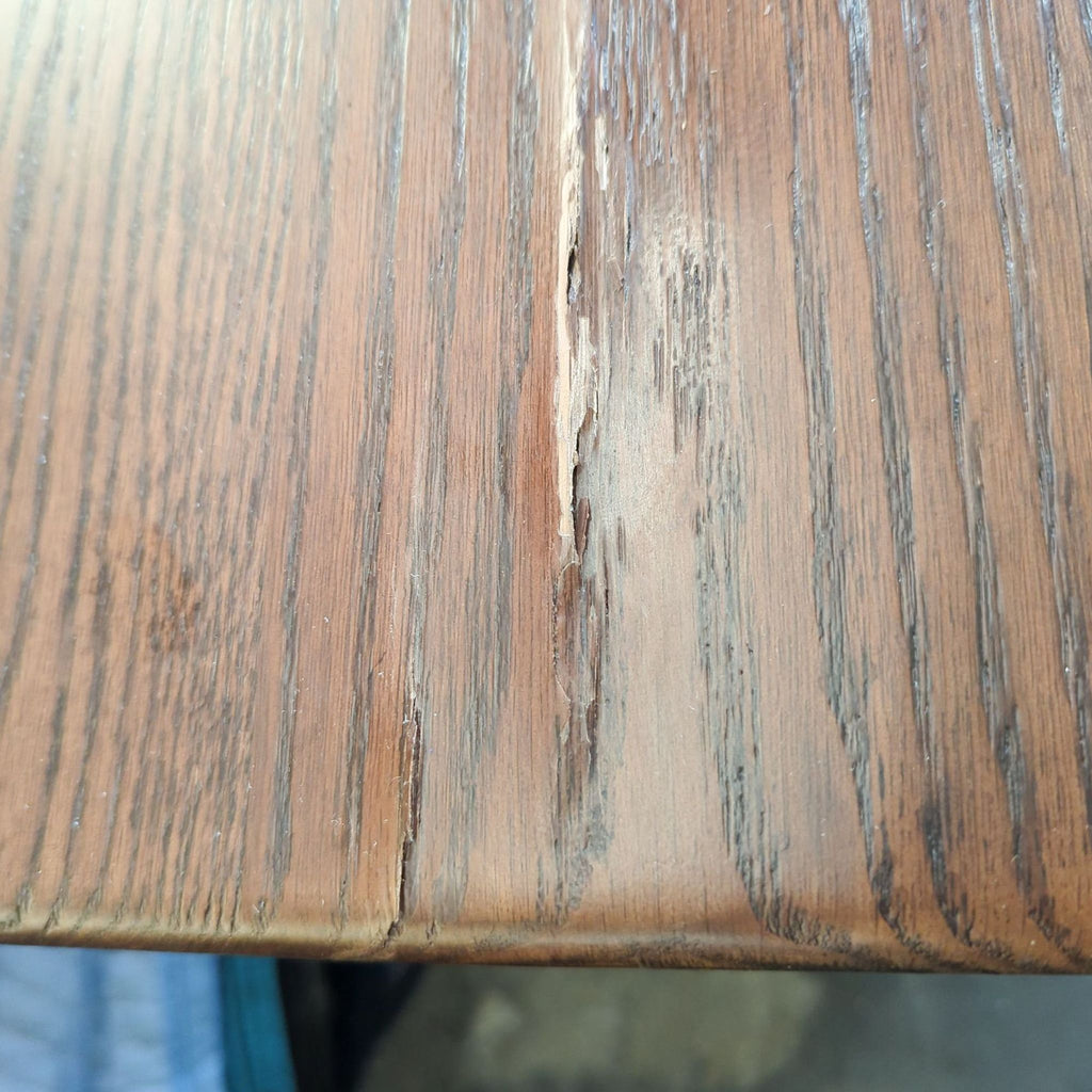 a wooden bench with a wooden handle 