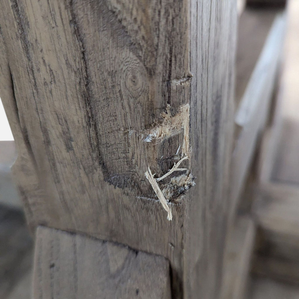 a bird is perched on a wooden post 