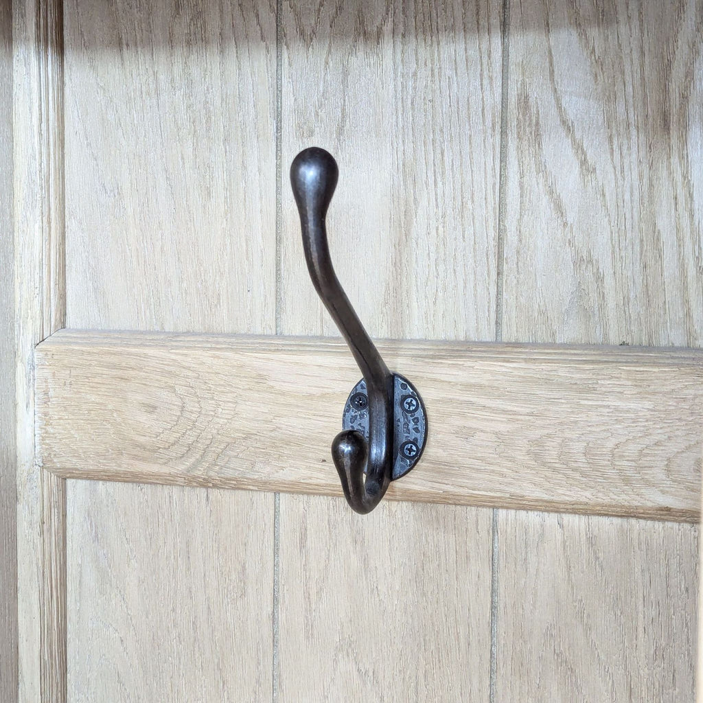 a wooden door with a wooden handle and a wooden plank 