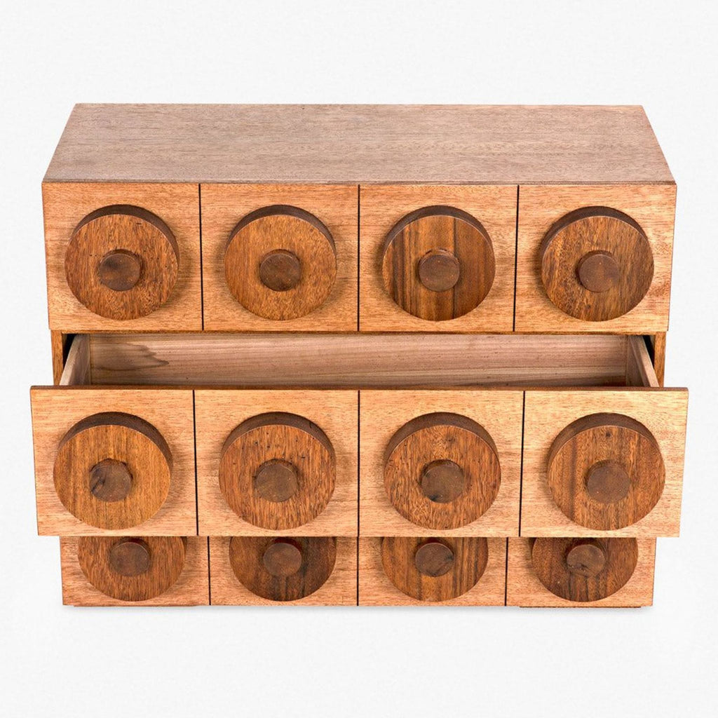 a wooden table topped with wooden barrels filled with wooden objects 