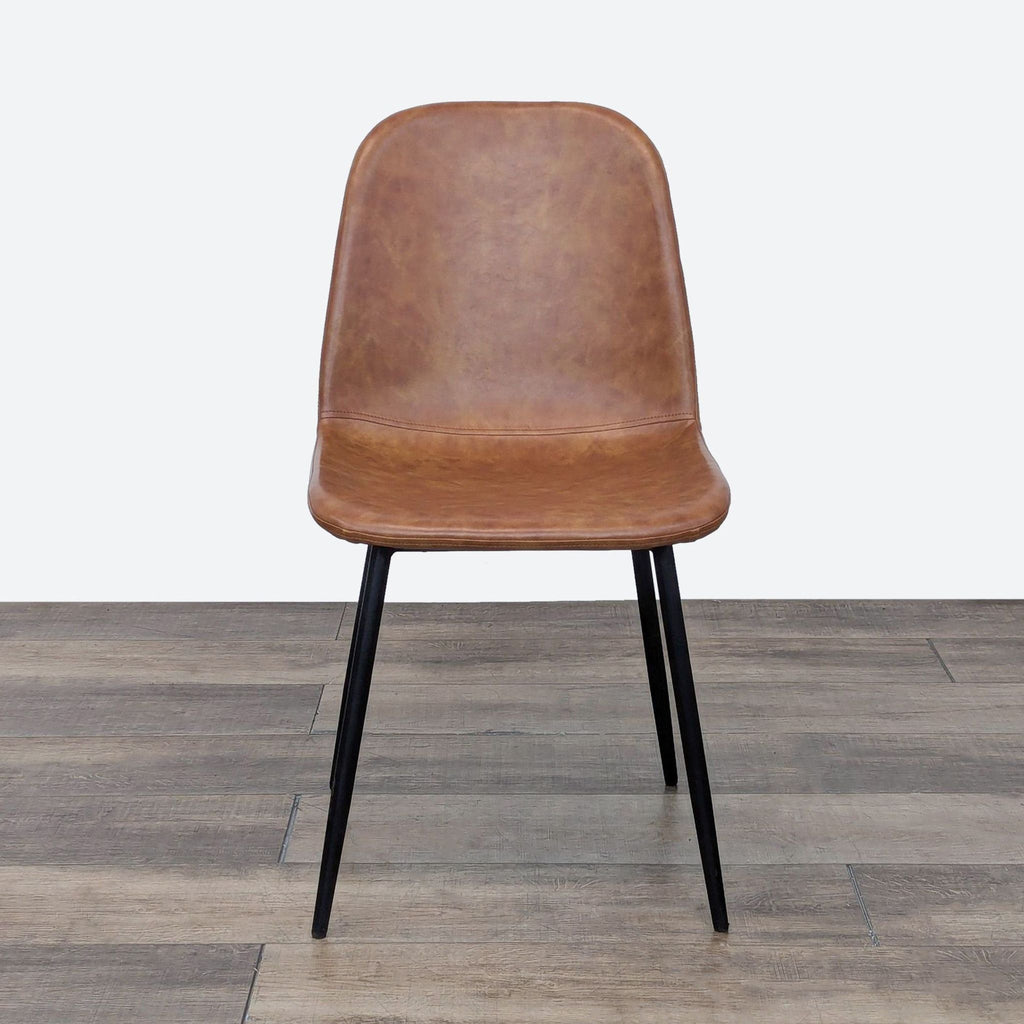 a wooden chair sitting on top of a floor 