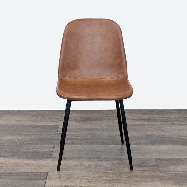 a wooden chair sitting on top of a floor 