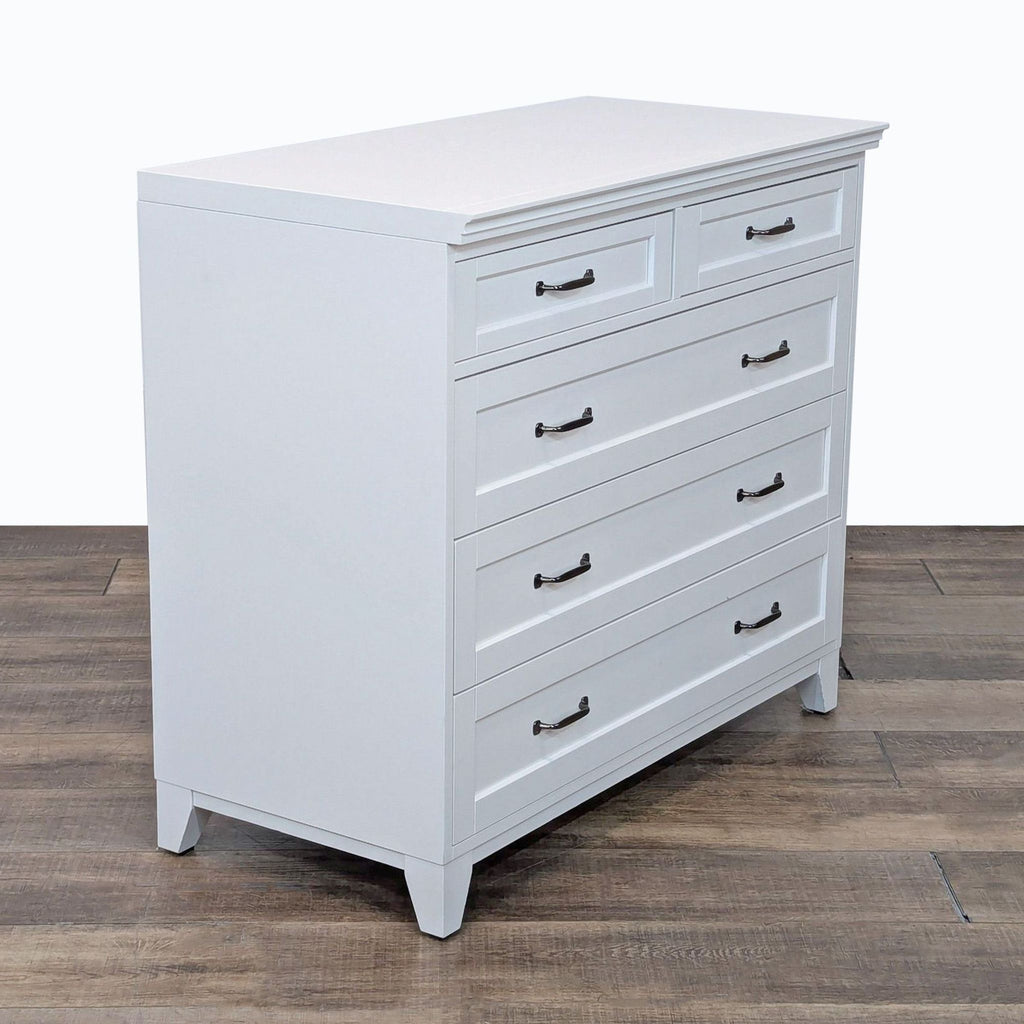 a wooden cabinet with a black and white striped dresser 