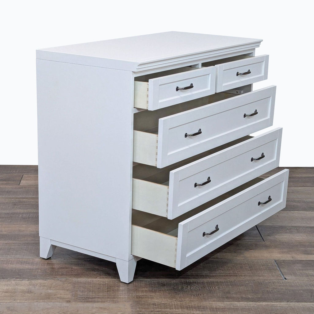 a white and black dresser with a black cabinet 