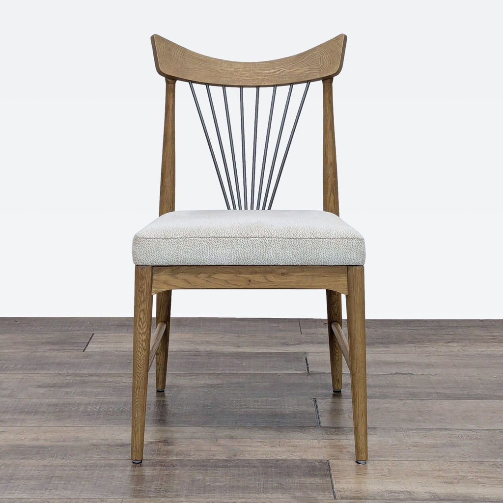 a wooden chair sitting on top of a wooden floor 