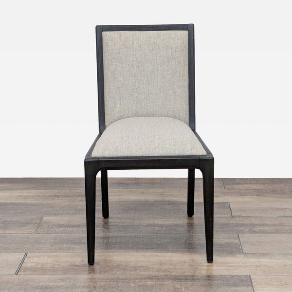 1. Front view of a Brownstone dining chair with light upholstered seat and back, dark wooden frame.