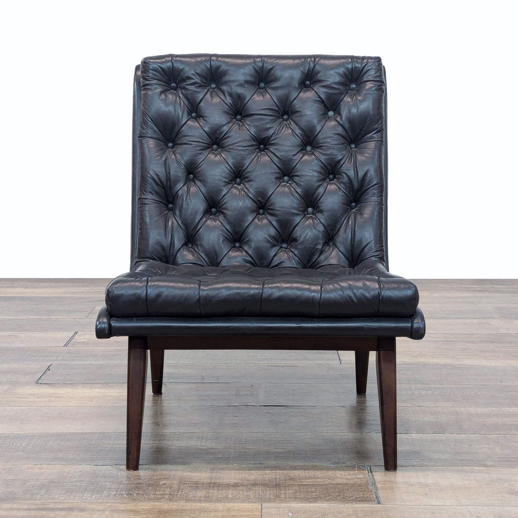 a black chair with a black leather seat 