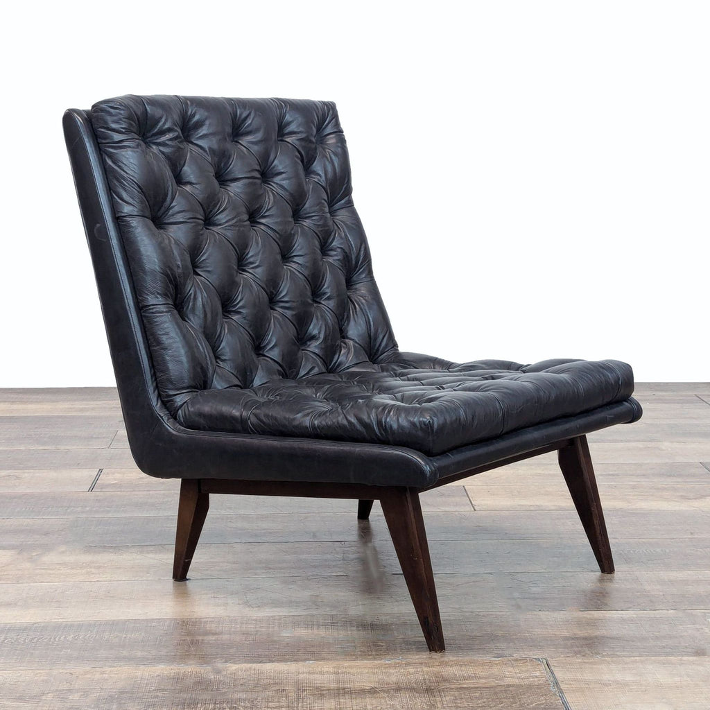 a black chair with a black leather seat 