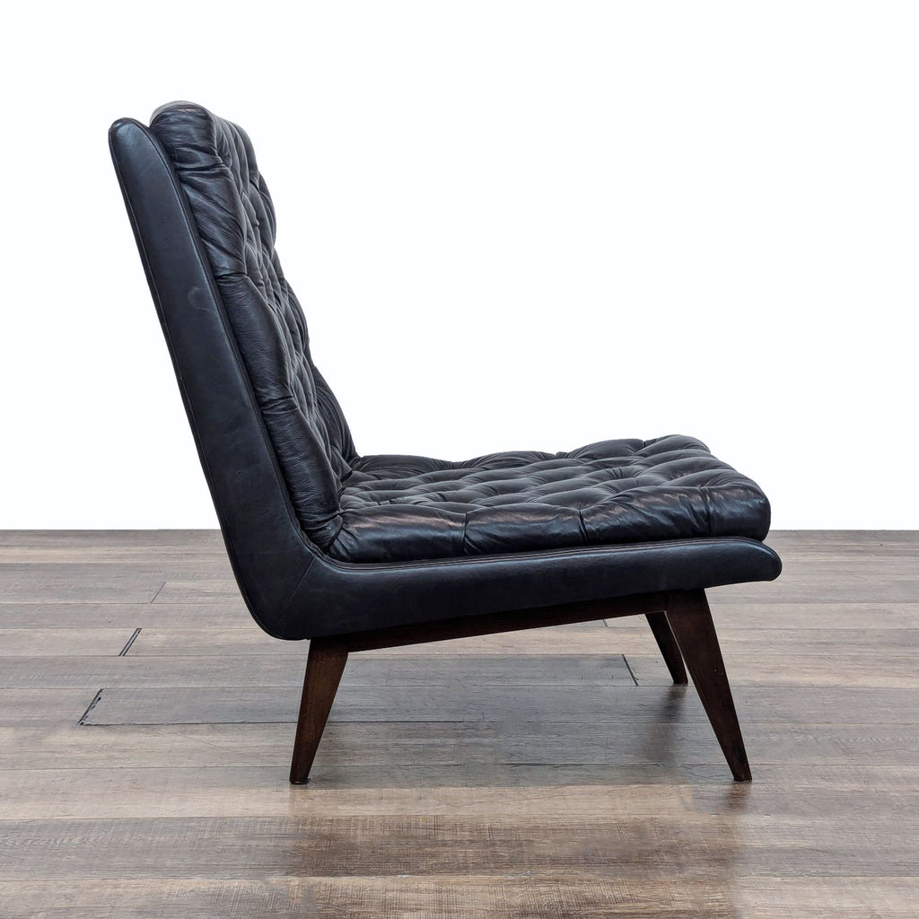 a black chair with a black leather seat 