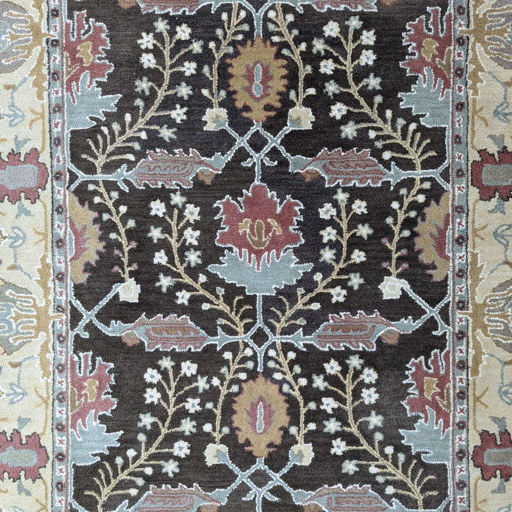 a large brown and white rug with a pattern of dots 