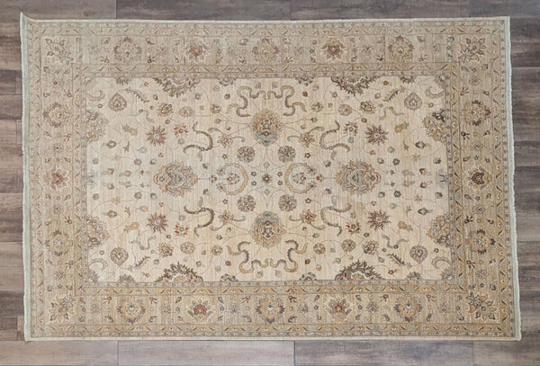 a large brown and white rug with a pattern on it 