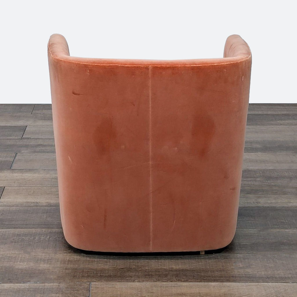 a large brown leather chair sitting on a floor 