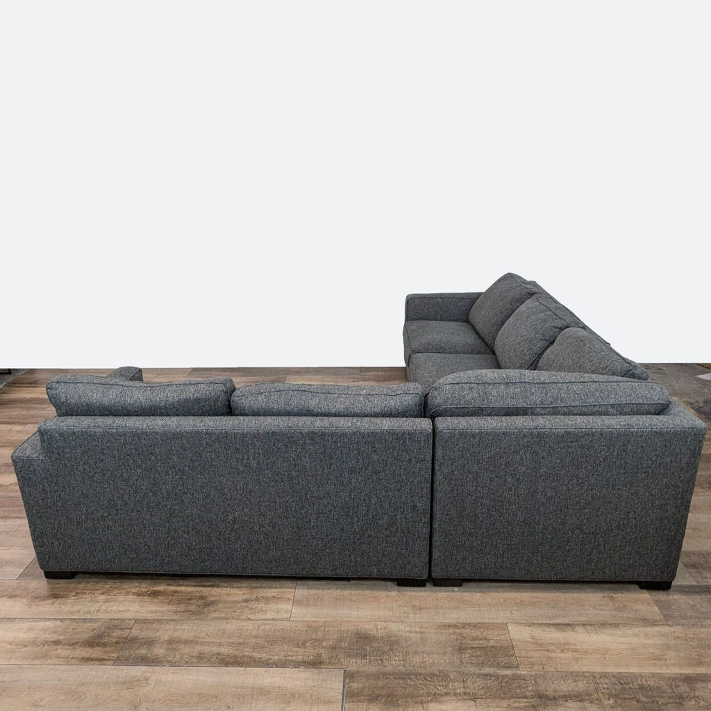 a couch with a black couch cushions and a black couch cushion 