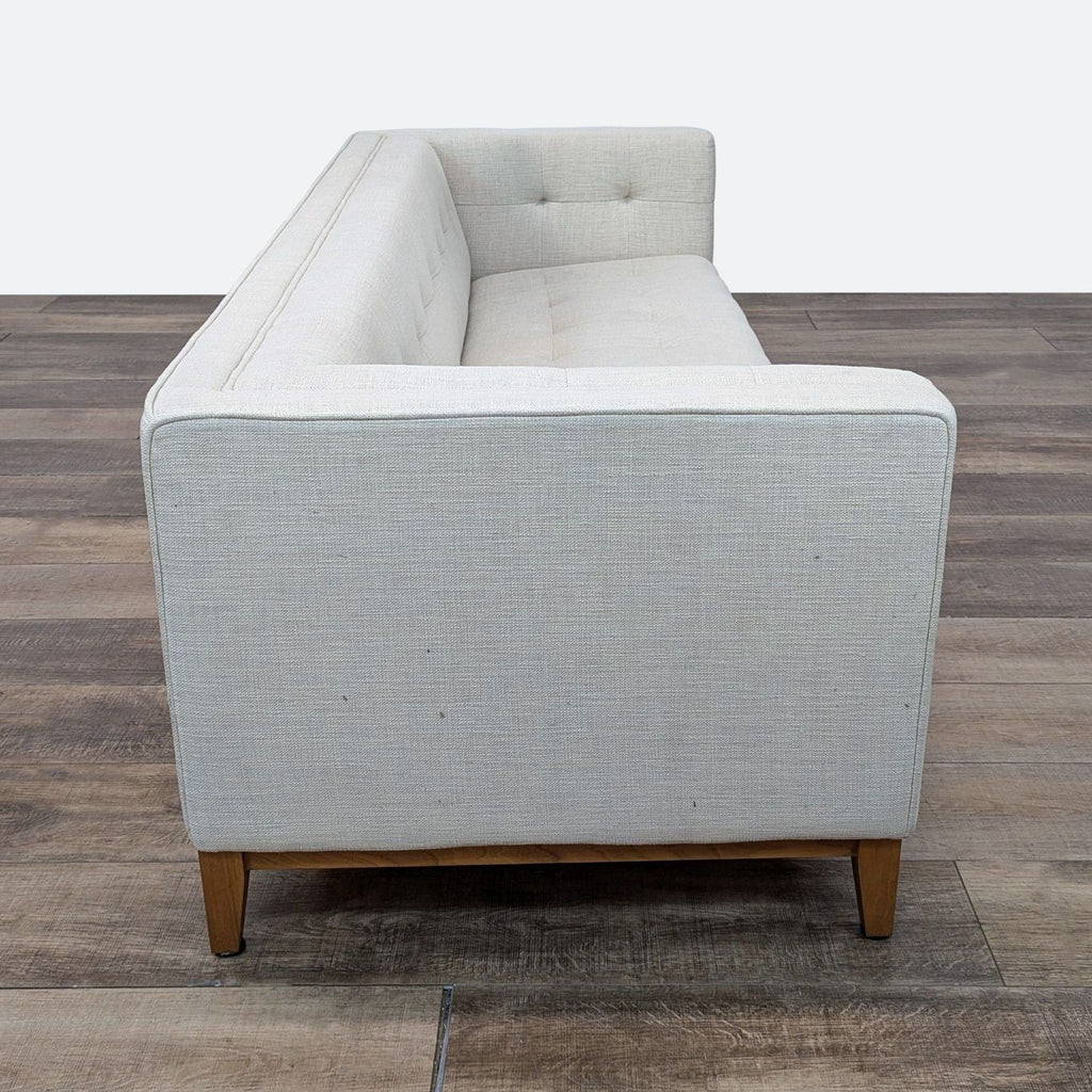 a white bath tub sitting on top of a wooden floor 