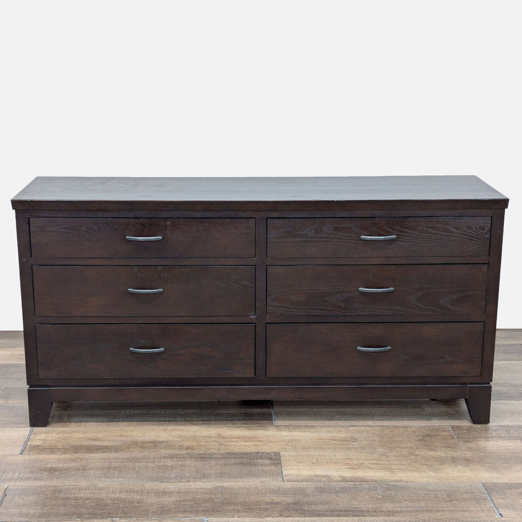 a white wooden dresser with a black cabinet 