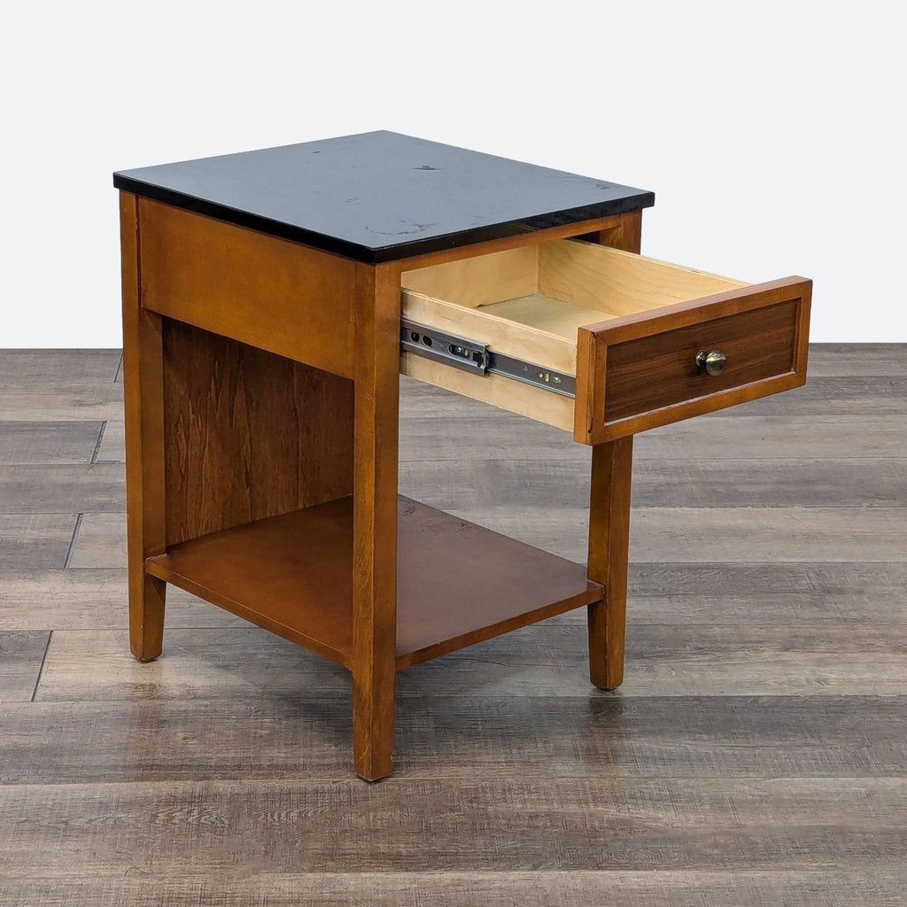 a wooden table with a wooden chair and a book 