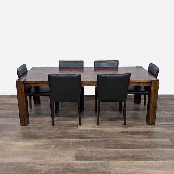 a wooden table with chairs and a wooden table cloth 