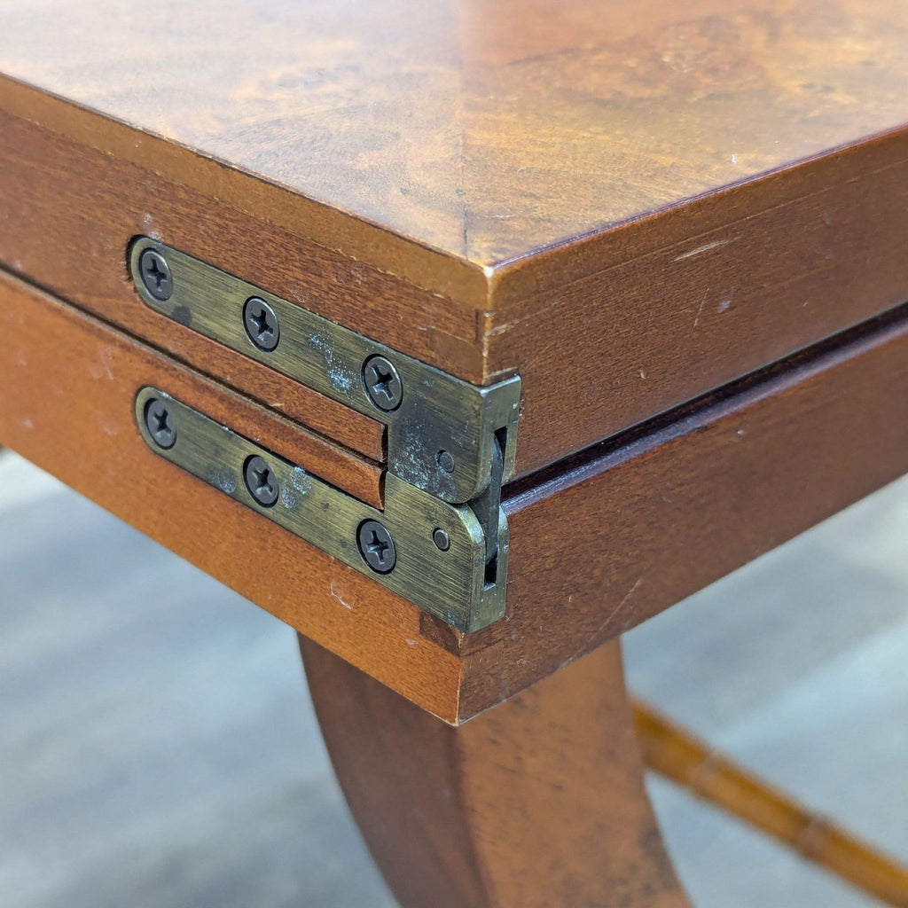 a wooden bench with a wooden handle on it 