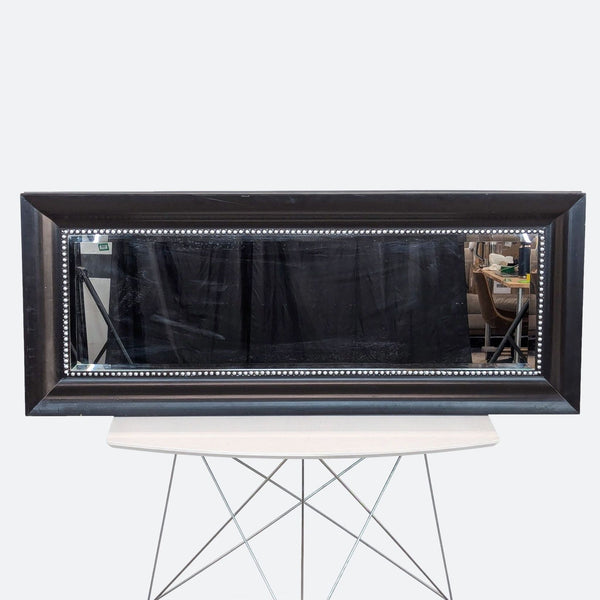 a small tv sitting on top of a wooden table 