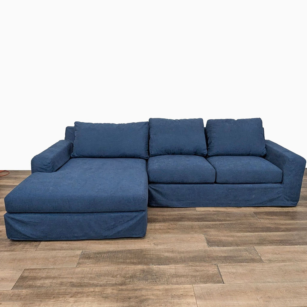 a couch with a blue couch cushions and a blue couch cushion 