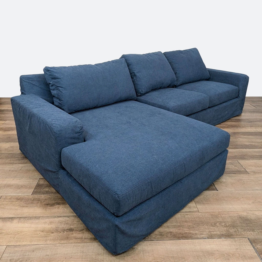 a couch with a blue couch cushions and a blue couch cushion 